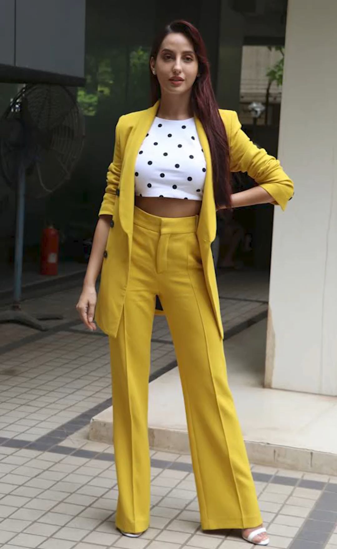 Nora Fatehi gives us boss babe vibes in a formal pastel green blazer skirt  set from Onarin